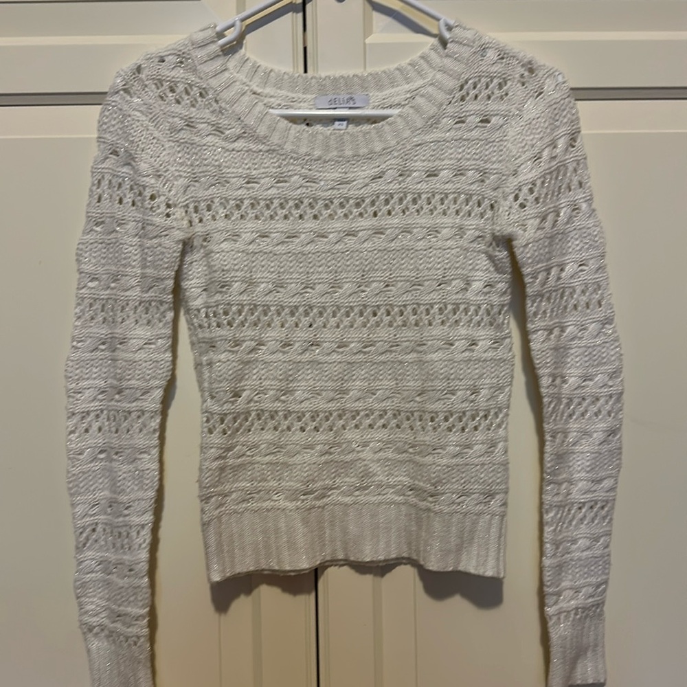 Delia’s white sparkly sweater